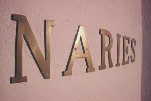 a sign that says no fires on a pink wall at Naries Namakwa Retreat in Goop