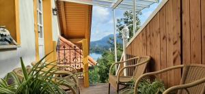 a balcony with chairs and a view of a lake at Apartment Milly in Bled +11 photos