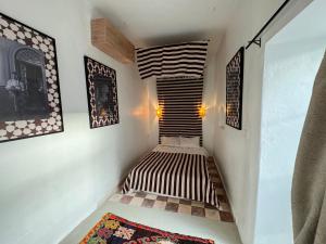 Postel nebo postele na pokoji v ubytování Riad Ait El Mouden