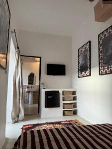 Postel nebo postele na pokoji v ubytování Riad Ait El Mouden