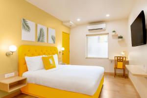 Postel nebo postele na pokoji v ubytování Bloom Hotel - CR Park