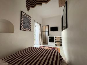 Postel nebo postele na pokoji v ubytování Riad Ait El Mouden