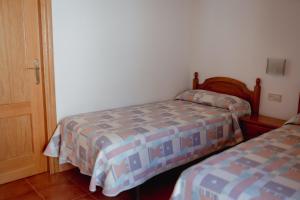 Postel nebo postele na pokoji v ubytování El Portal de la Irene Apartamentos Rurales