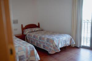 Postel nebo postele na pokoji v ubytování El Portal de la Irene Apartamentos Rurales