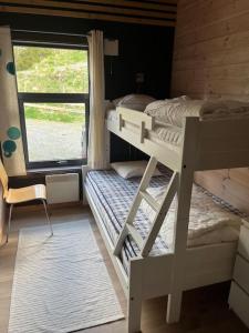 เตียงในห้องที่ Moderne hytte Sjusjøen