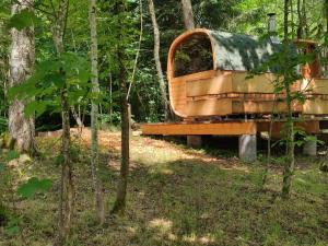 an old truck sitting in the woods at Altes Forsthaus Bodenmais in Bodenmais