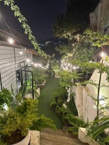a garden at night with lights and plants at Beaumont Da Lat Villa in Da Lat +17 photos