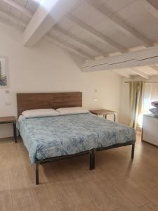 A bed or beds in a room at Carrera Home Appartamenti Verona - Bike Hotel