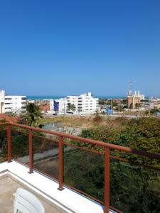 a balcony with a view of a city at Casa de praia do Zeca in Fortaleza