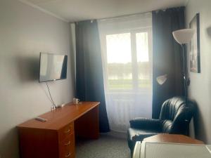 TV a/nebo společenská místnost v ubytování Riverside Motel Jelgava