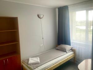 Postel nebo postele na pokoji v ubytování Riverside Motel Jelgava