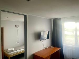TV a/nebo společenská místnost v ubytování Riverside Motel Jelgava