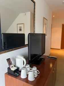 TV a/nebo společenská místnost v ubytování Novotel Hildesheim + 37 fotografií