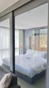 Postel nebo postele na pokoji v ubytování AdWords Mountain View CityGate Kamala