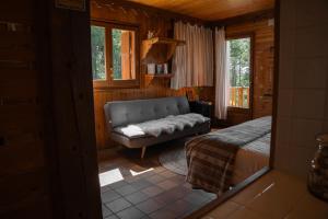Postel nebo postele na pokoji v ubytování Minds & Mountains Eco Lodge