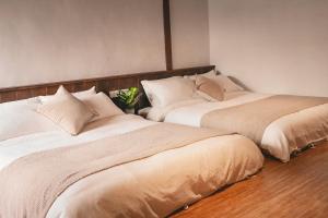 Postel nebo postele na pokoji v ubytování Shenzhai Shiyuan B&B