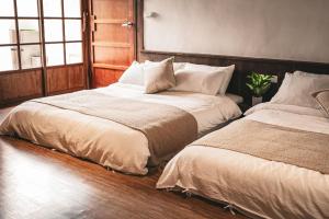 Postel nebo postele na pokoji v ubytování Shenzhai Shiyuan B&B
