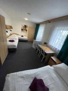 Posteľ alebo postele v izbe v ubytovaní Hotel Remy