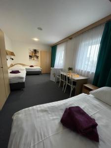 Posteľ alebo postele v izbe v ubytovaní Hotel Remy