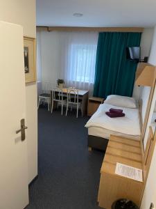 Posteľ alebo postele v izbe v ubytovaní Hotel Remy