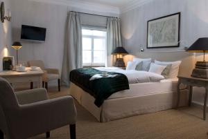 Postel nebo postele na pokoji v ubytování Brauereigasthof-Hotel Aying