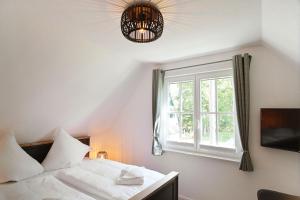 Postel nebo postele na pokoji v ubytování Sandregenpfeifer