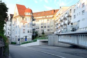 an empty street in front of a building at VISIONAPARTMENTS St Gallen - contactless check-in in St. Gallen