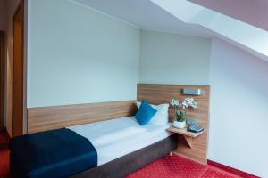 Postel nebo postele na pokoji v ubytování Hotel Andra München