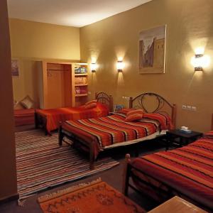 Postel nebo postele na pokoji v ubytování LESCALE DE OUARZAZATE