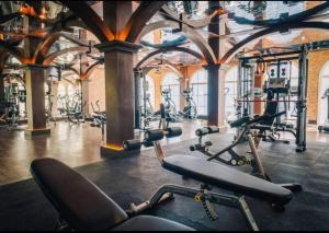 a gym with a bunch of exercise bikes in it at Luxury 1 Bedroom condo close to Beach - G411 in Na Jomtien