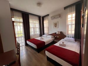 Postel nebo postele na pokoji v ubytování Şima Hotel Kemer