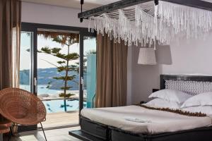 Letto o letti in una camera di Myconian Utopia Relais & Chateaux