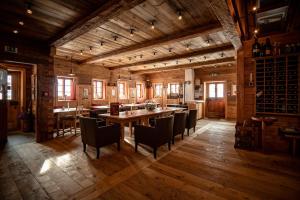 a large dining room with a table and chairs at Der Gannerhof in Innervillgraten
