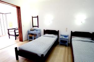 מיטה או מיטות בחדר ב-Golden Apartments