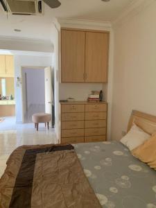 Postel nebo postele na pokoji v ubytování Cityscape KL + 7 fotografií