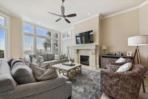 a living room with two couches and a fireplace at 2 Collier Beach- Oceanfront, Dog Friendly , Private Pool, FREE Activities in Hilton Head Island