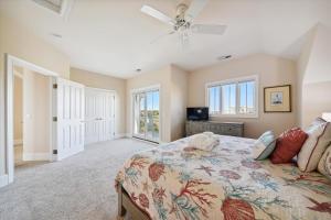 a bedroom with a bed with a dog laying on it at 2 Collier Beach- Oceanfront, Dog Friendly , Private Pool, FREE Activities in Hilton Head Island +52 photos