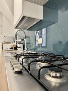 a kitchen with a stove top in a kitchen at LianHome b&b "Volte" in Lucera