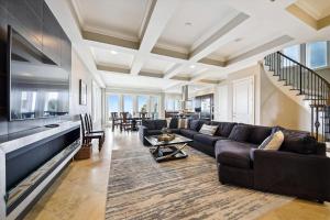 a living room with a couch and a table at 27 Singleton Beach- Oceanfront, Private Pool, Pool Table, FREE Activities Included in Hilton Head Island