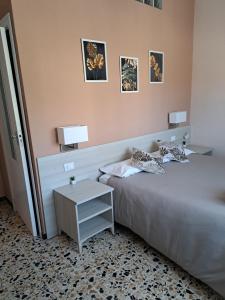 Postel nebo postele na pokoji v ubytování La terrazza del Sole Guest House