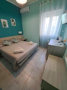 Postel nebo postele na pokoji v ubytování La terrazza del Sole Guest House