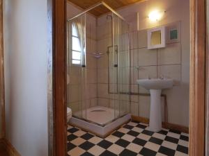 a bathroom with a shower and a sink at Autumn Breeze Manor Guest House in Graskop +149 photos