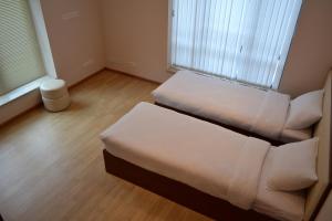 Postel nebo postele na pokoji v ubytování Villadzor Apart Hotel