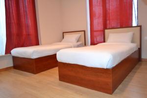 Postel nebo postele na pokoji v ubytování Villadzor Apart Hotel