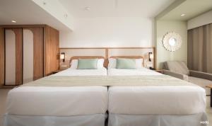 Rúm í herbergi á Riu Negril - All Inclusive