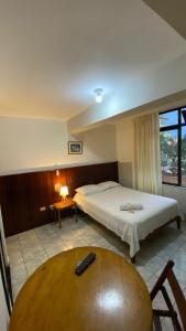 Кровать или кровати в номере Happy Day Pucallpa