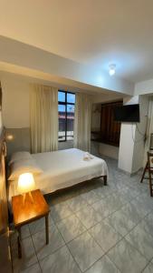 Кровать или кровати в номере Happy Day Pucallpa