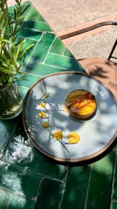 a plate with eggs on it on a table at Domaine de la Roseraie Resort in Ouirgane +48 photos