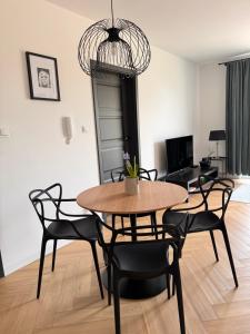a dining room with a table and chairs at TOTie in Grudziądz +24 photos