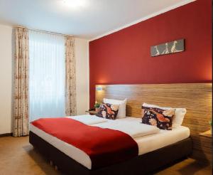 Postel nebo postele na pokoji v ubytování Hotel Andra München